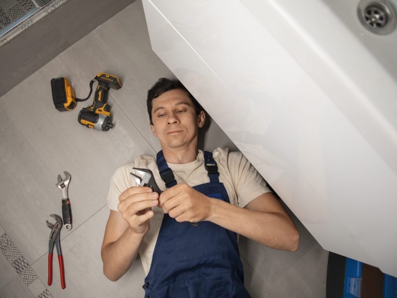 male-plumber-working-fix-problems-client-s-house